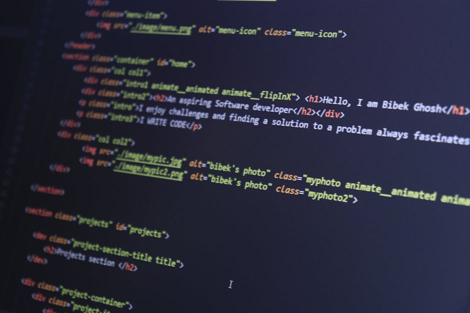 A detailed close-up of a computer screen displaying HTML code with colorful syntax highlighting, including tags such as <h1>, <div>, and <img>. The code references images labeled 'bibek's photo' with