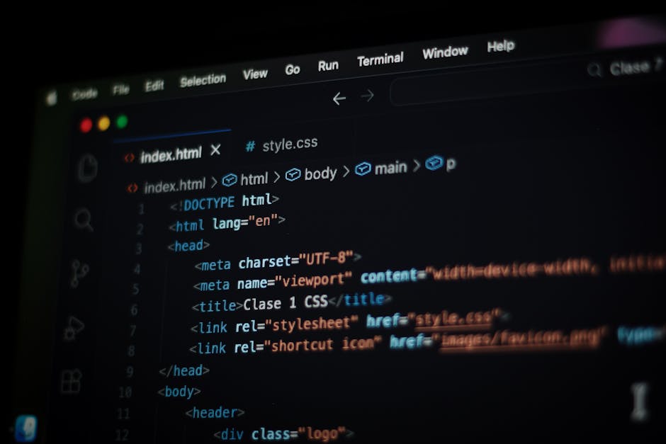 A detailed close-up of a computer screen displaying HTML code with colorful syntax highlighting, including tags such as <h1>, <div>, and <img>. The code references images labeled 'bibek's photo' with